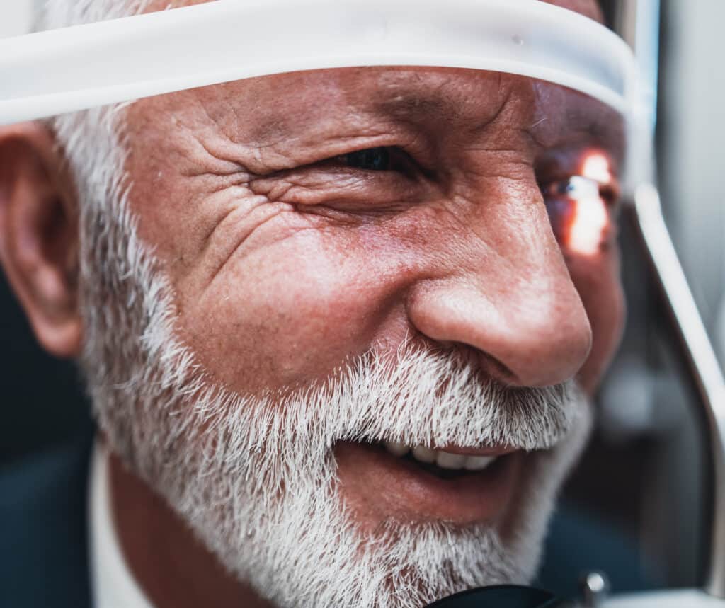 Elegant Senior Bearded Man Receiving Ophthalmology Treatment. Do